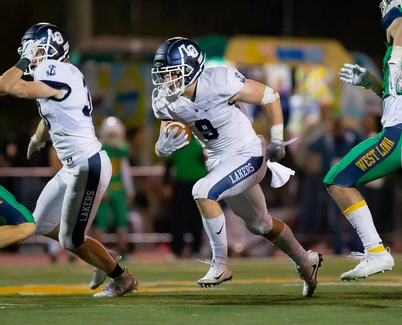 Senior Casey Filkins rushed for 180 yards and two touchdowns Friday at West Linn. (Photo by Brad Cantor)