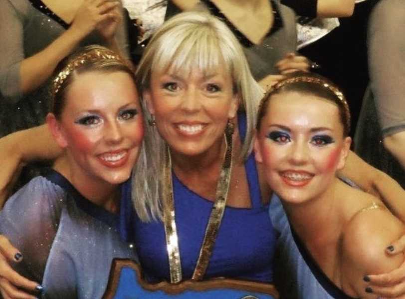 Robin Meier with her daughters, Lexi and Belle, celebrate winning the 2012 4A Large State Dance Championship.