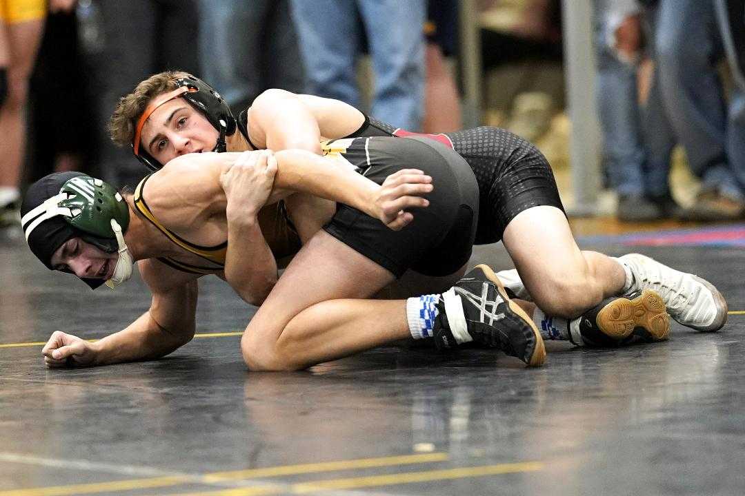 Crecent Valley's Gabe Whisenhunt (top) works against Cascade's Daniel Moore in the quarterfinals. (Photo by Jon Olson)