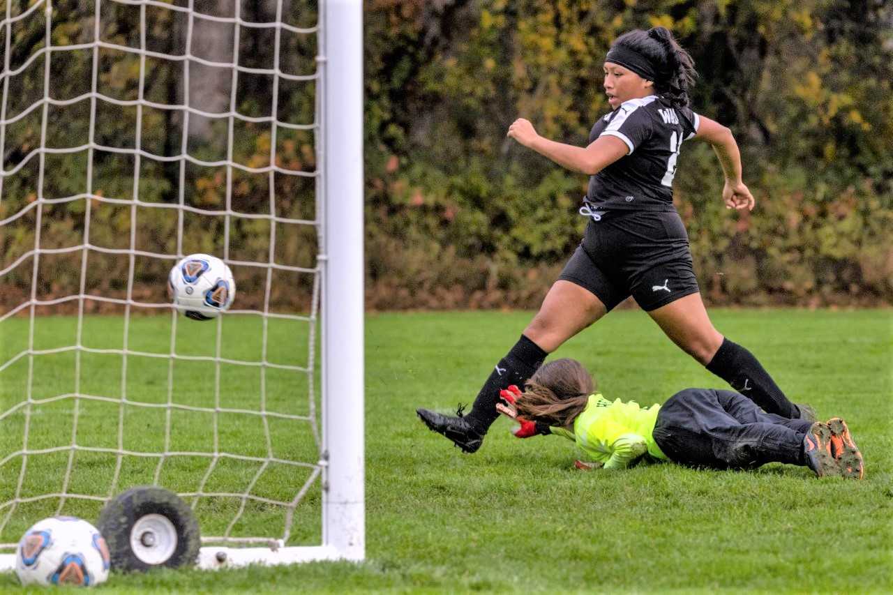 Philomath's Elizabeth Morales-Marquez scores one of her two goals in Tuesday's win. (Logan Hannigan-Downs/Philomath News)