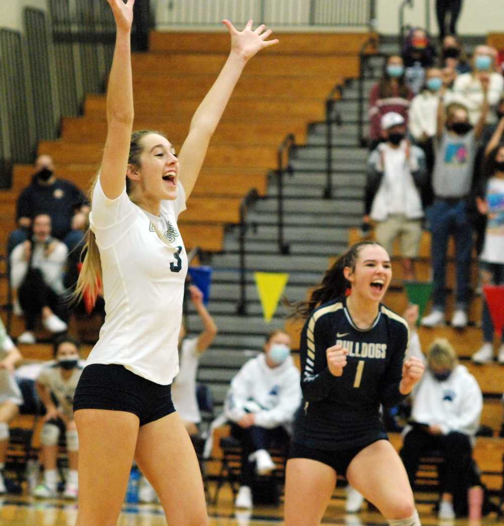 Hailey Heider (3) and Maddy Hellum (1) had a lot to celebrate after West Albany's four-set win in this afternoon's 5A semifinal