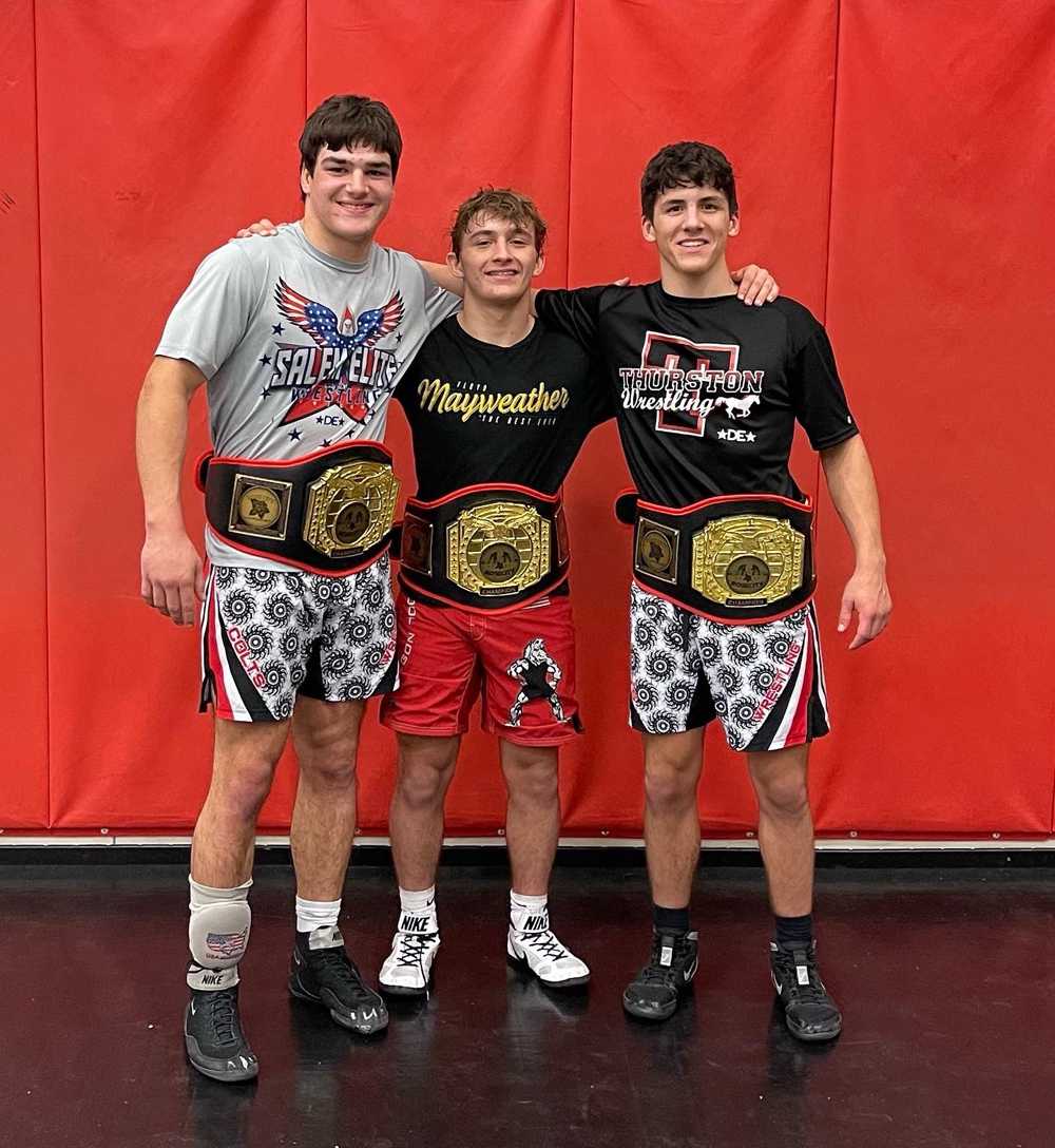 Thurston's Vaun Halstead (left), Kolton Malone (center) and Logan Slonecker show off the spoils of a great weekend at Rose City