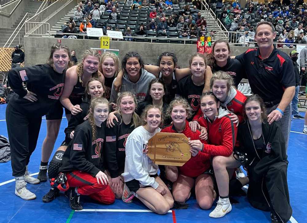 Thurston's girls, shown here, and boys, both won titles on Saturday, a first in the long history at the Oregon Wrestling Classic