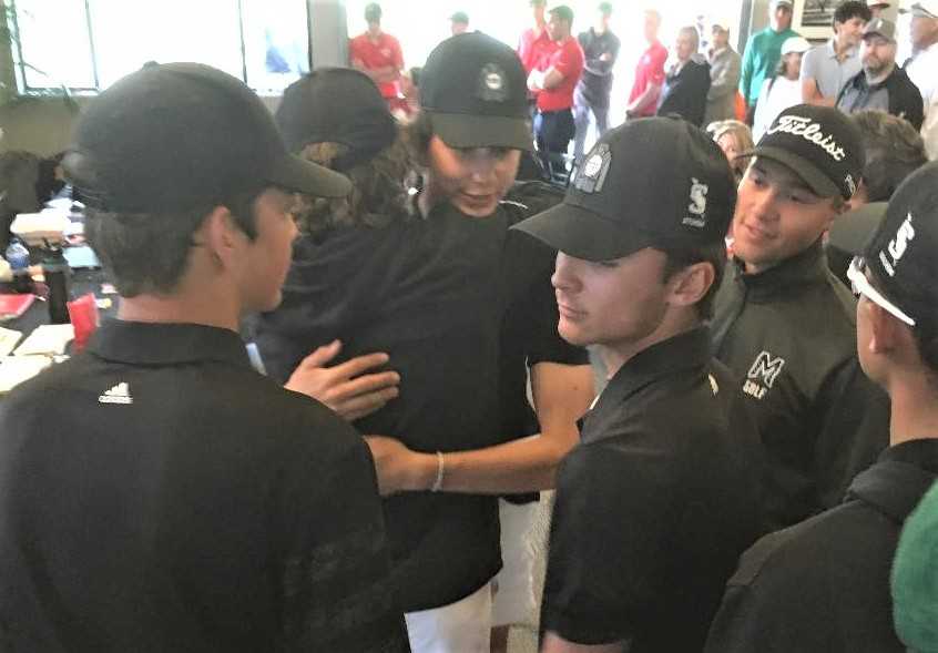 Summit players congratulate teammate Brody Grieb after he won the 6A title Tuesday at Trysting Tree Golf Course.