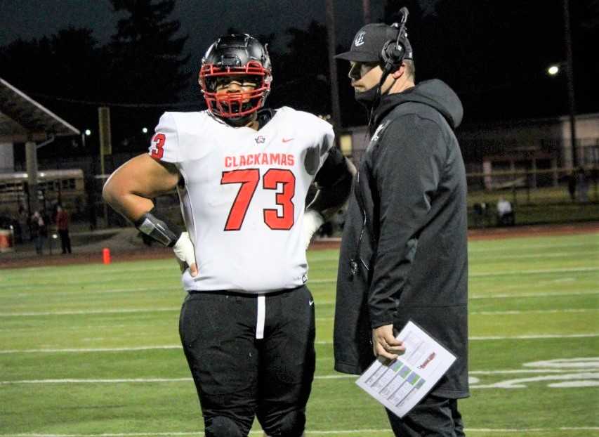 Devin Brooks, with coach James Holan, was a Mt. Hood Conference first-team offensive lineman last season. (Photo by Davina Sims)