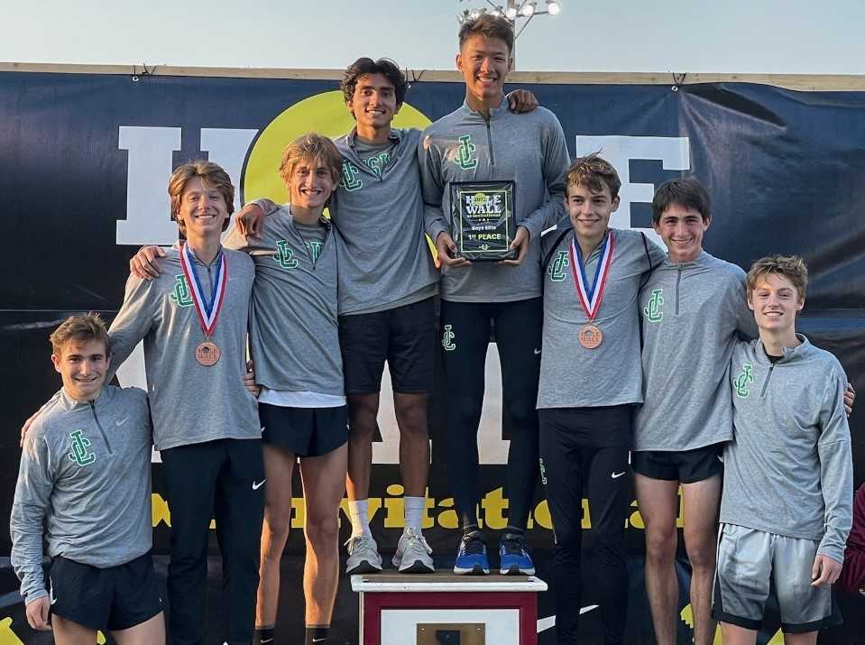 Jesuit's boys pose with their first-place trophy at the Nike Hole in the Wall Invitational on Saturday in Arlington, Wash.