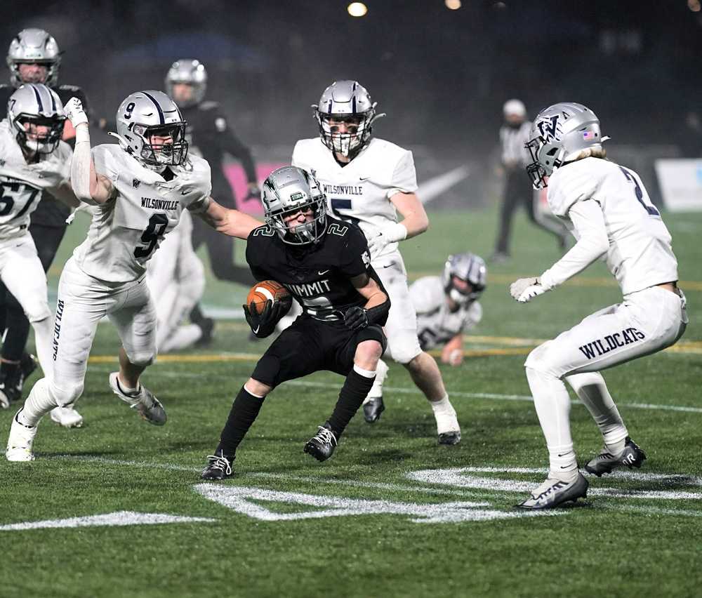 Summit Storm's Sam Stephens (2) shook several Wilsonville Wildcats on his way to 235 rushing yards for the 5A champs (Jon Olson)