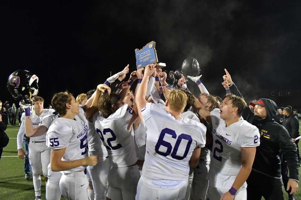 Cascade Christian's players celebrate their first title since 2017 (Andre Panse)