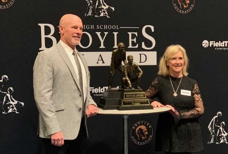 Karl Halberg and his wife Suzie received the High School Broyles Award during a banquet Monday in Little Rock, Ark.