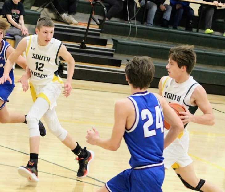 South Wasco County's Jason Hull (12) runs the break with senior James Best in Tuesday night's Big Sky League home victory.