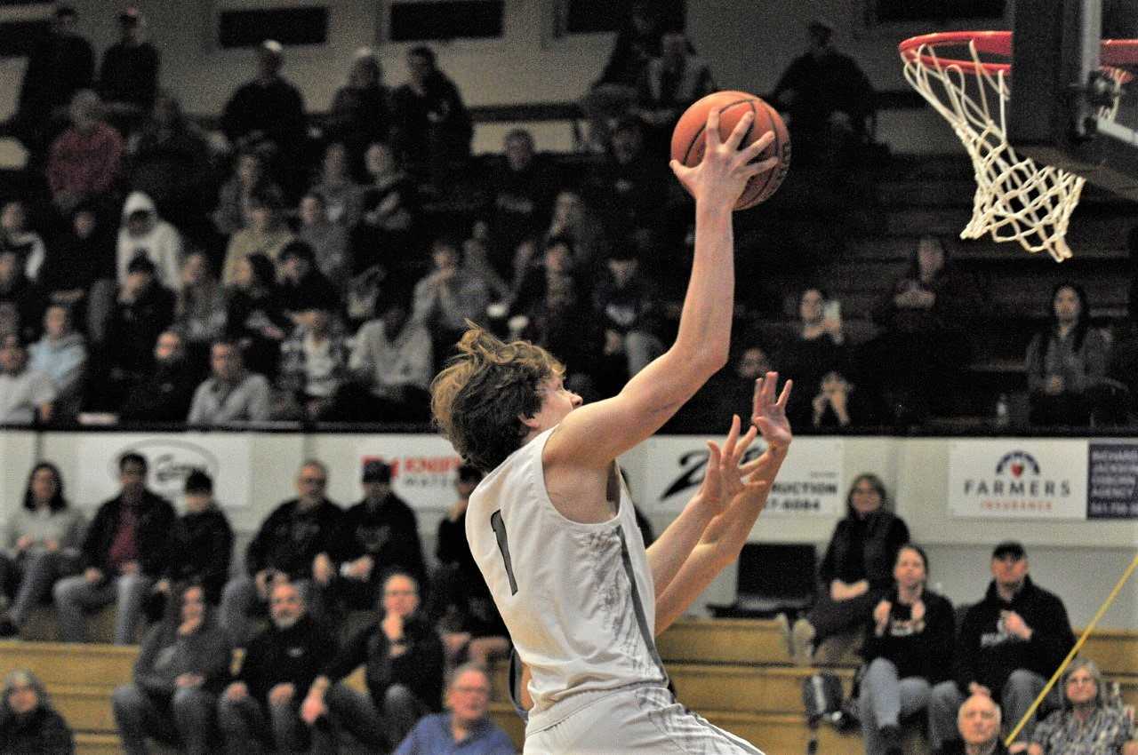Westside Christian's Wesley Chandler goes up for two points against Oregon Episcopal on Friday. (Photo by John Gunther)