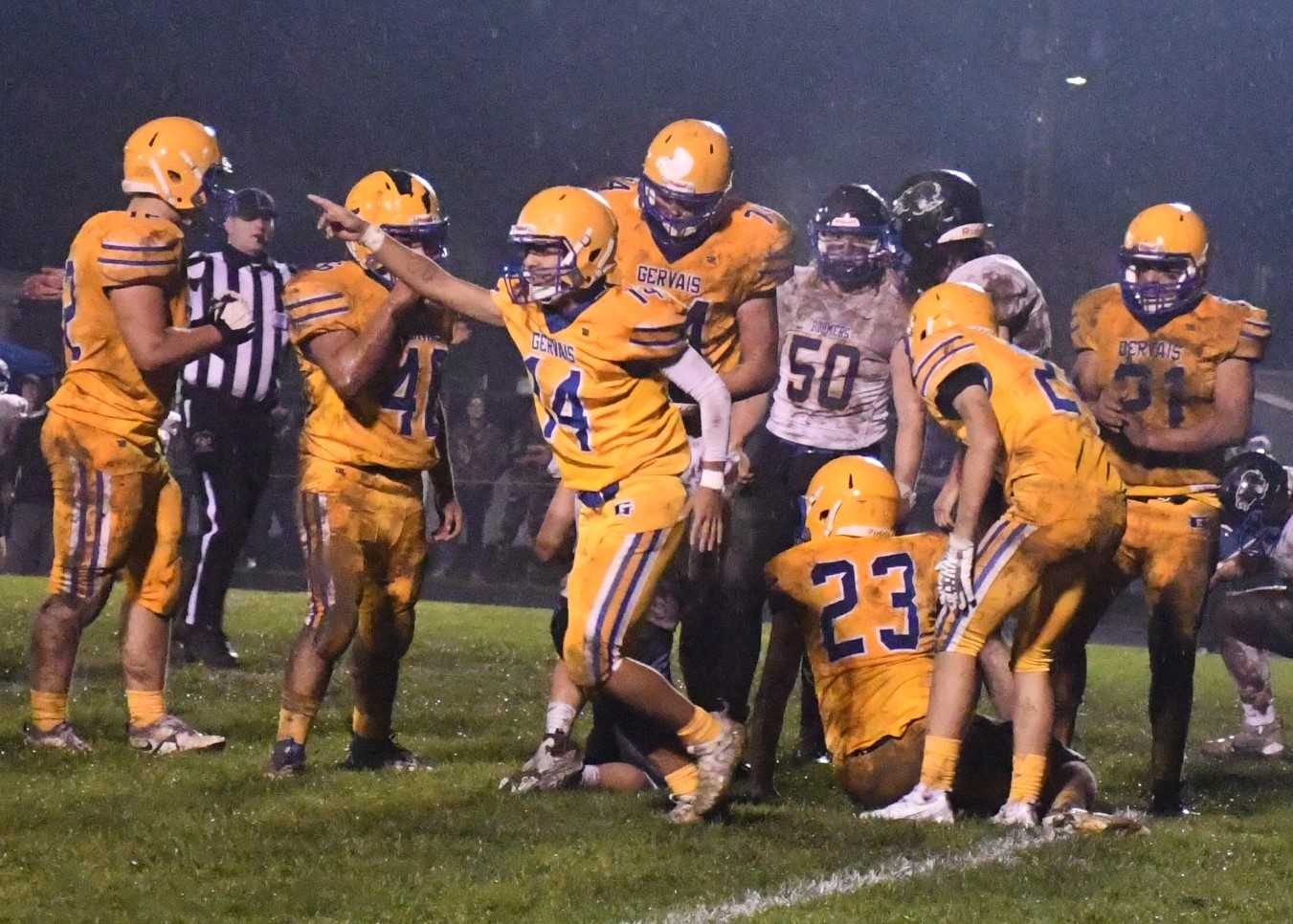 Gervais players celebrate forcing a turnover in their 24-12 first-round playoff win over Toledo. (Photo by Jeremy McDonald)