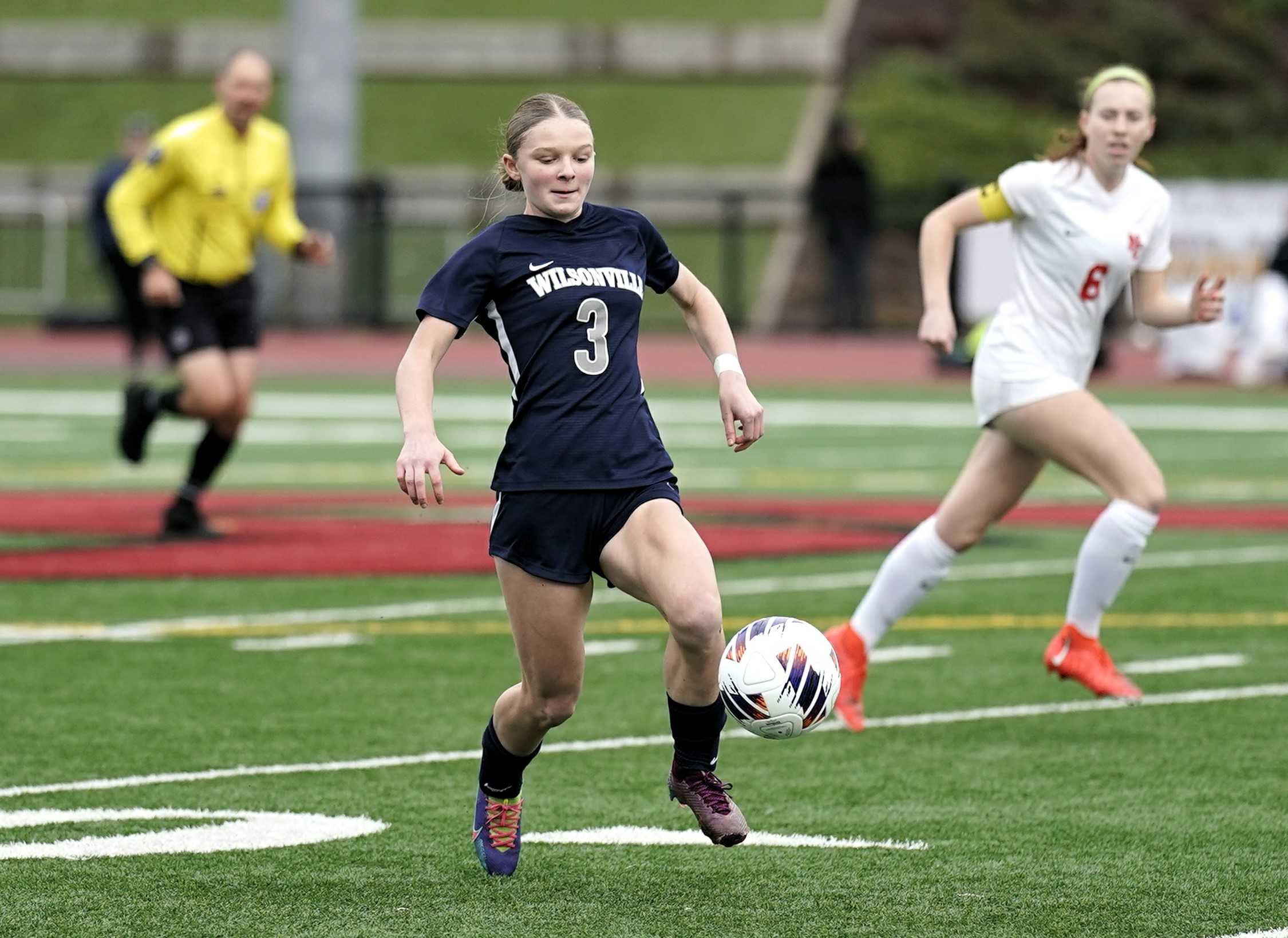 Wilsonville sophomore Camryn Schaan works the ball up the field Saturday against North Eugene. (Photo by Jon Olson)