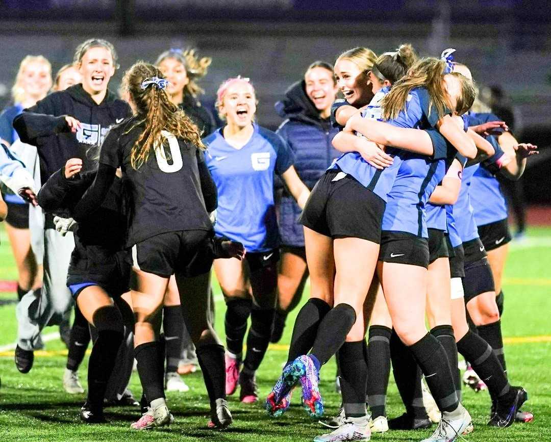 Grant players celebrate after defeating Cleveland 3-2 in overtime in the 6A girls soccer final Saturday. (Photo by Jon Olson)