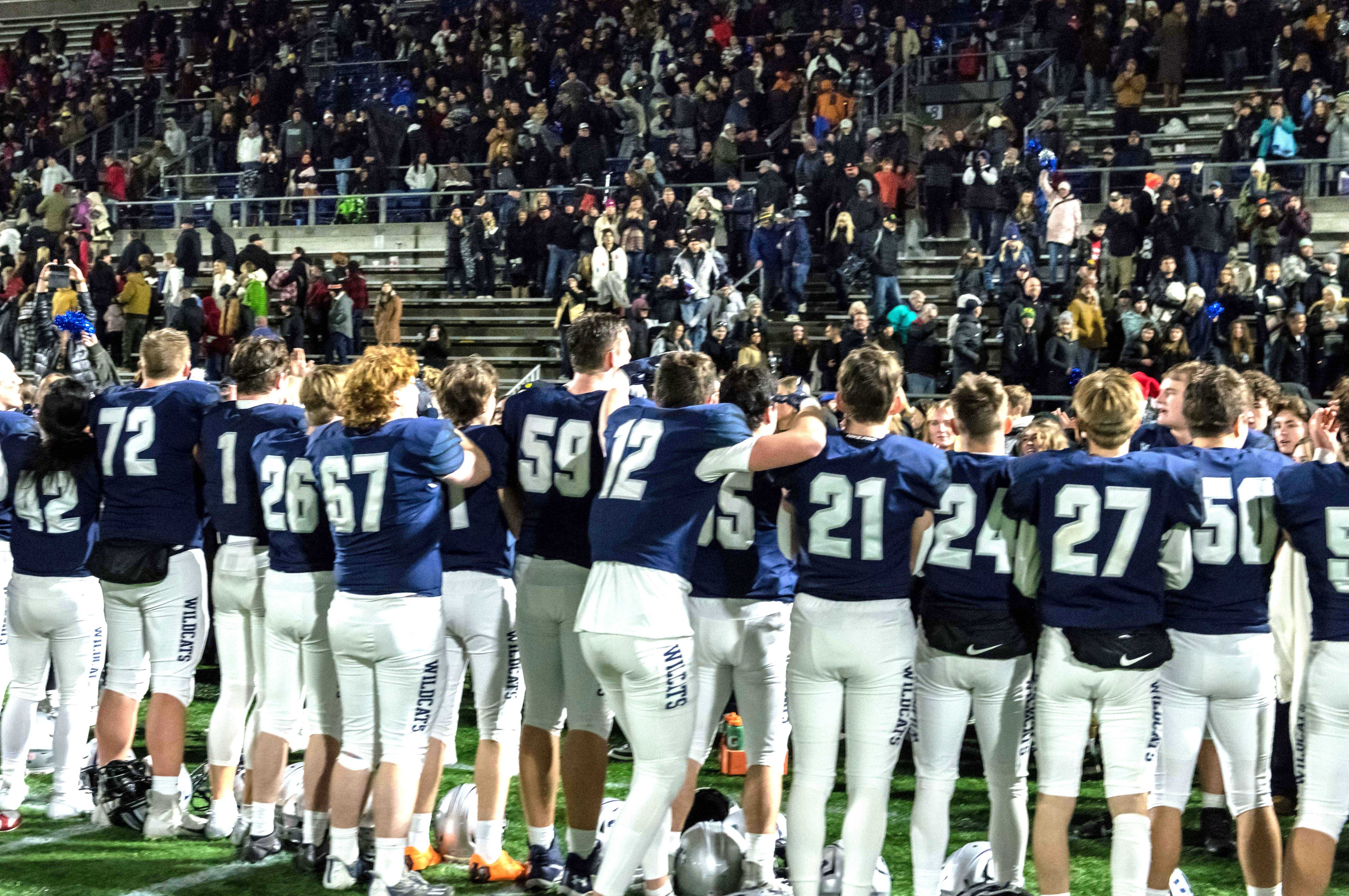 Wilsonville players celebrate with their fans after beating Mountain View in the 5A final in November. (Photo by Greg Artman)