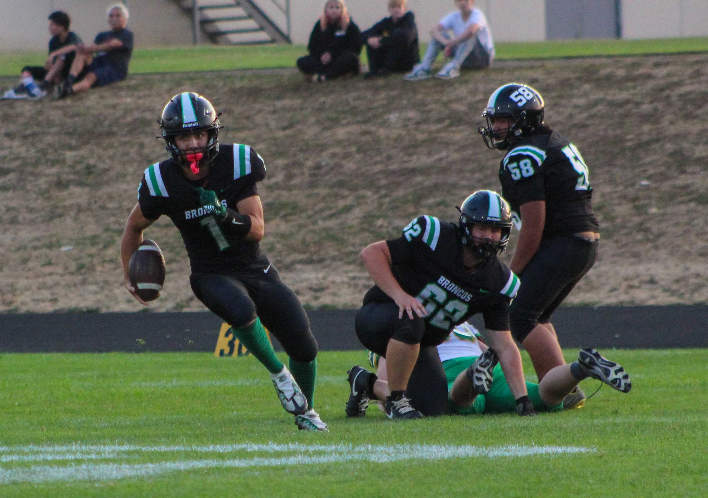 Parkrose senior Tranden Stricker, left, rushes the ball against Cleveland. (Photo by Austin White)