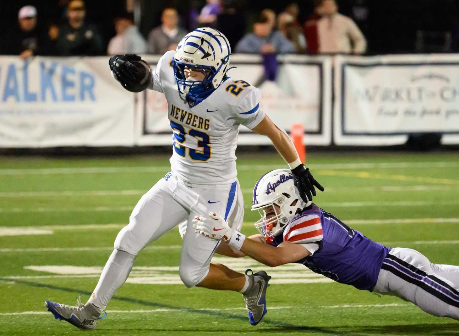 Senior Chace Macken (23) is the leading rusher and a standout at middle linebacker for Newberg. (Ric Getter/Valley Times)