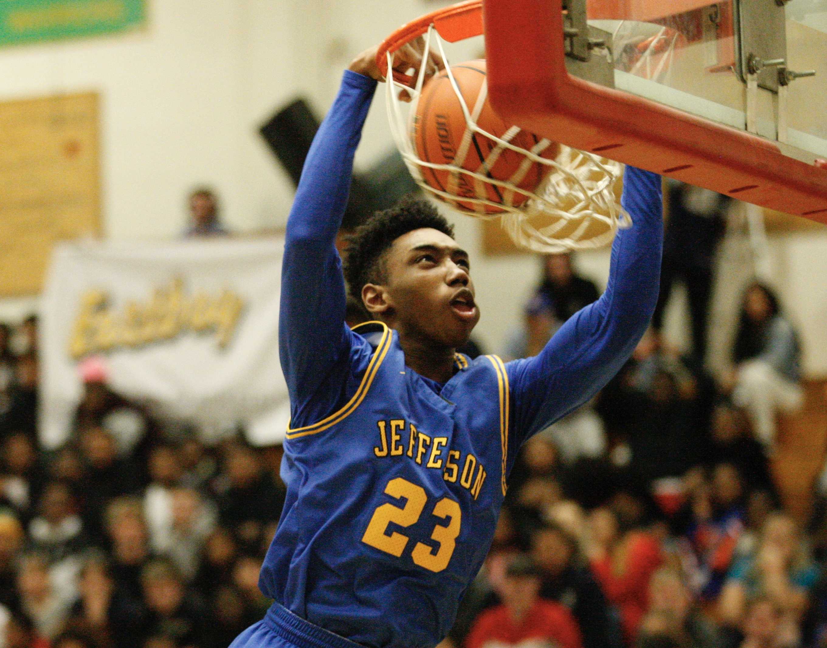 Jefferson's Jonathon Nchekwube slams in the last two points of the first quarter for the Democrats on Saturday night.