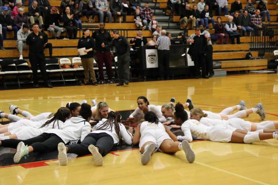 The Southridge girls basketball team in its final preparation before tip-off. (Courtesy of Southridge Yearbook)