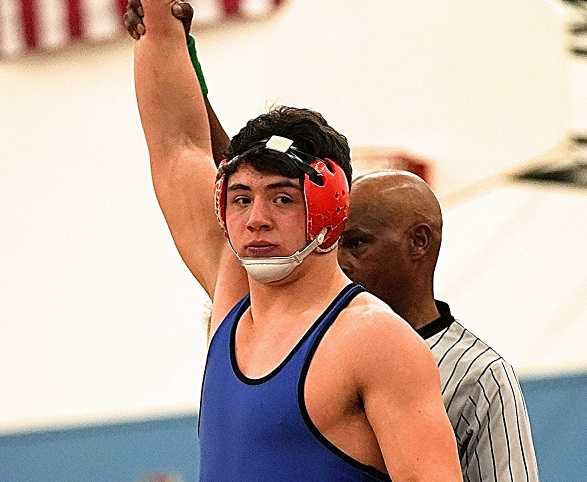 Newberg's Oliver Myers was one of three Tigers to record pins against Roseburg. (Photo by Jon Olson)