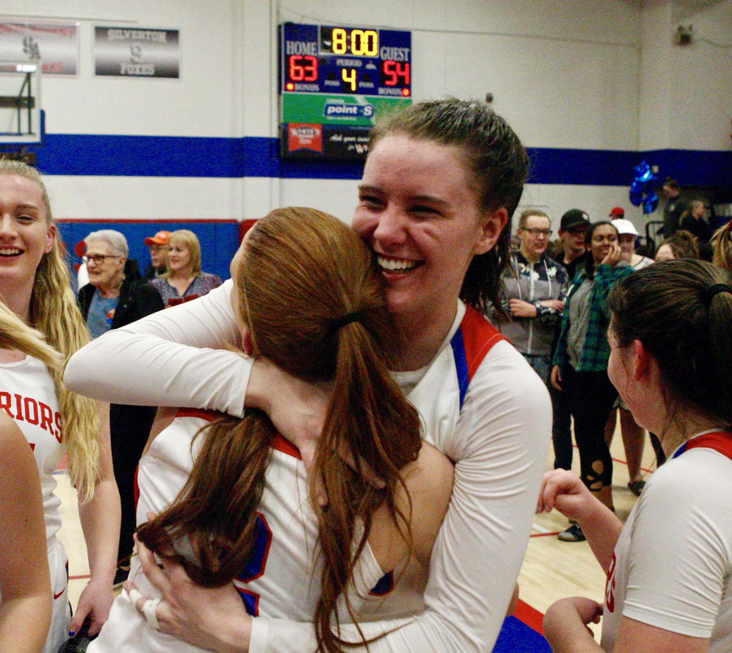 Lebanon's Ellie Croco is all smiles as she hugs teammate Maddy Romeo after the victory over Crescent Valley.
