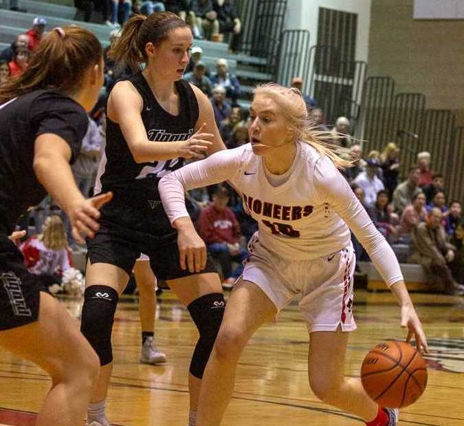 Oregon City's Brooke Bullock is cut off by Tigard's Campbell Gray (left) and Delaney Leavitt (center). (Photo by Tamara Peyton)