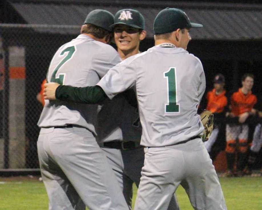 North Marion's Noah Wierstra (12) and Ryan Olson (1) celebrate with Grant Henry after beating Gladstone. (Photo by Anna Iliyn)