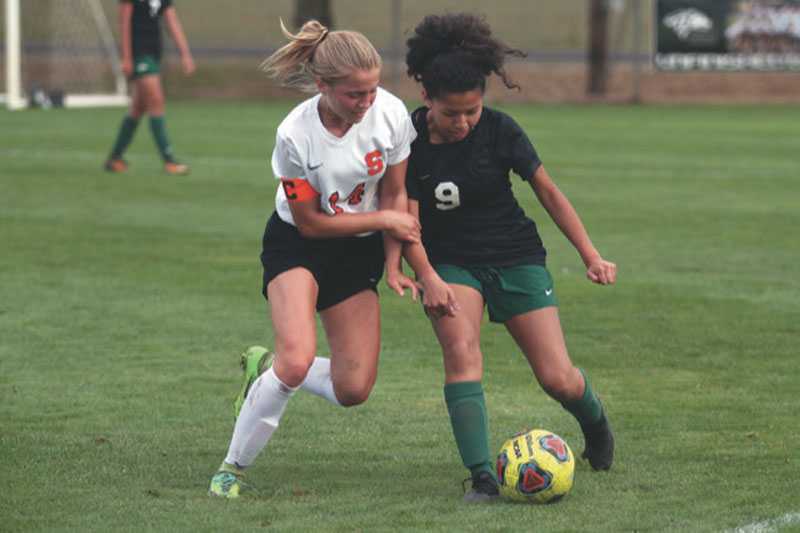 Scappoose is off to a strong start in 2019 with Emma Jones (left) leading the way. Photo by Phil Hawkins