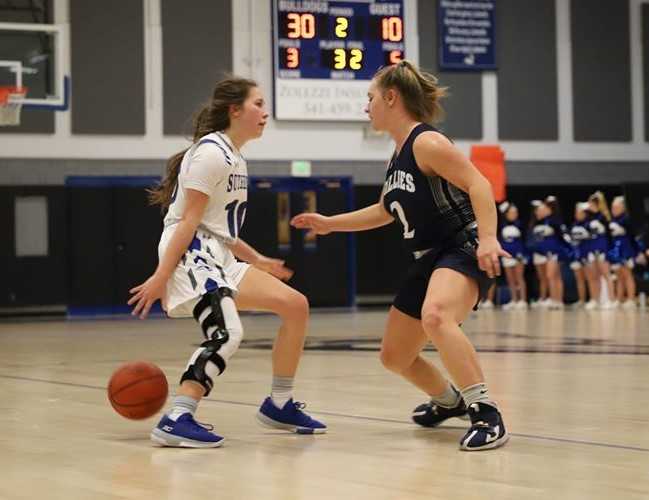 Sutherlin's Kiersten Haines (left) made 11 three-pointers in one game this season. (Photo by DelRae Bodine)