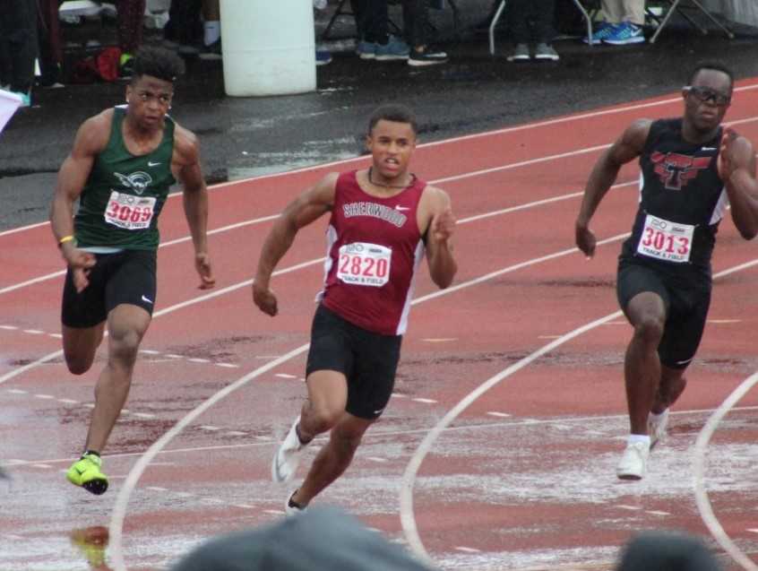 Sherwood's Caleb Hagan (center) won the 100 and 200 meters in the 6A meet last year. (Photo courtesy Sherwood HS)