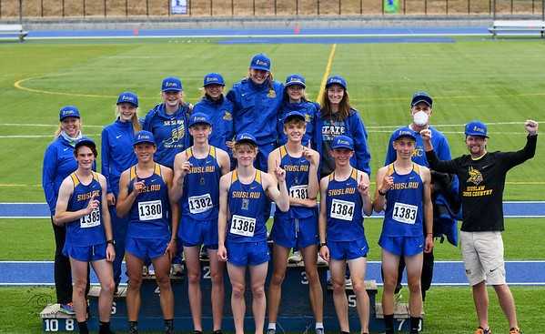 Siuslaw's boys and girls celebrate winning Northwest Classic team titles Saturday in Eugene. (Photo by Becky Holbrook)