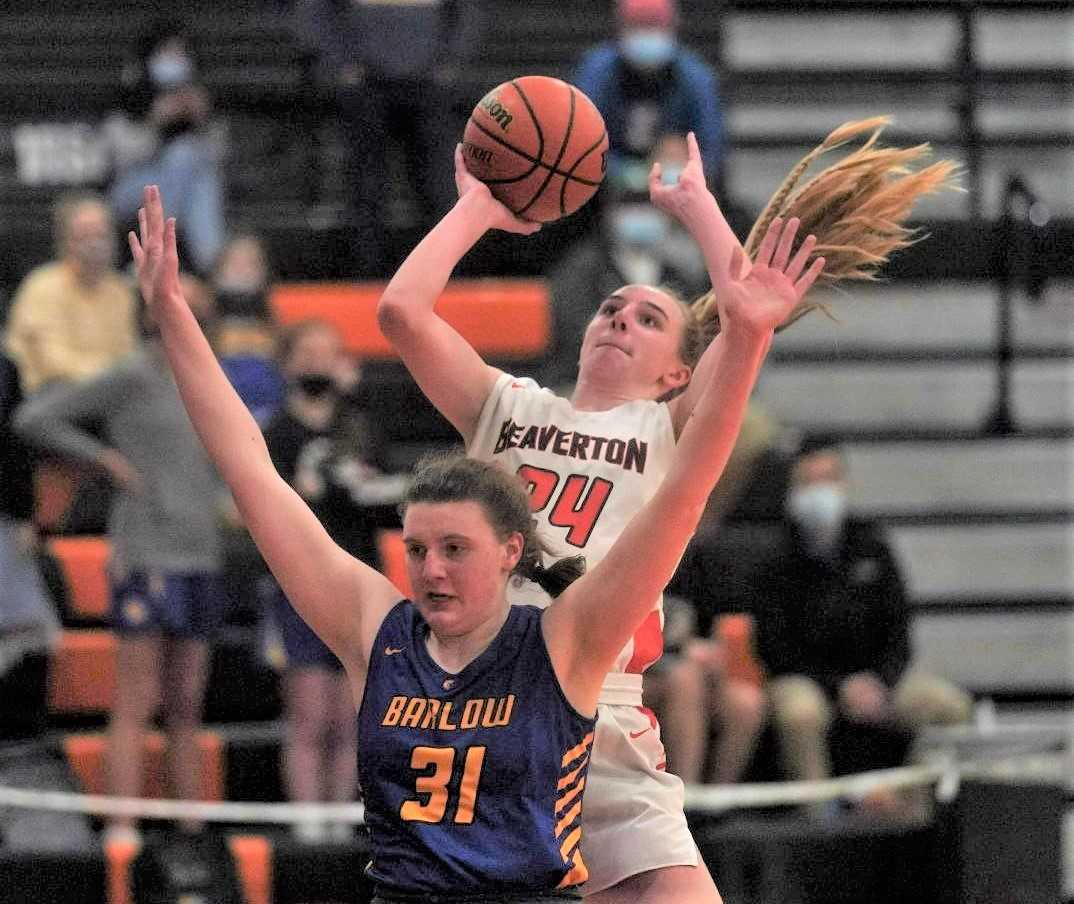 Beaverton's Lainey Spear (24) shoots over Barlow's Rilyn Quirke (31) in Wednesday night's nonleague game. (Photo by Jon Olson)