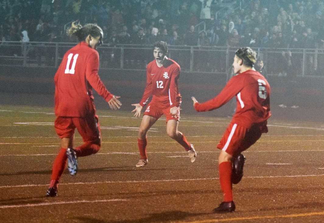 La Salle Prep's Luke Strange (11), Kainoa Taylor (12) and Karter Cook (6) celebrate the winning goal. (Photo by Lauren Craven)