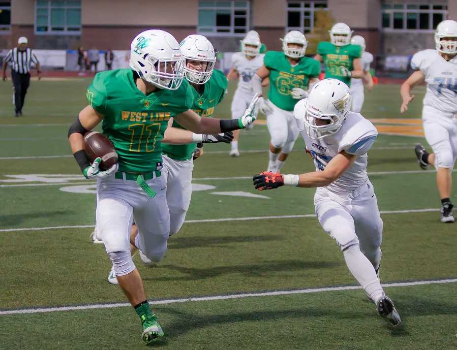 West Linn's Brodie Corrigan scored three touchdowns in a 45-28 win over Lakeridge on Sept. 21. (Photo by Brad Cantor)