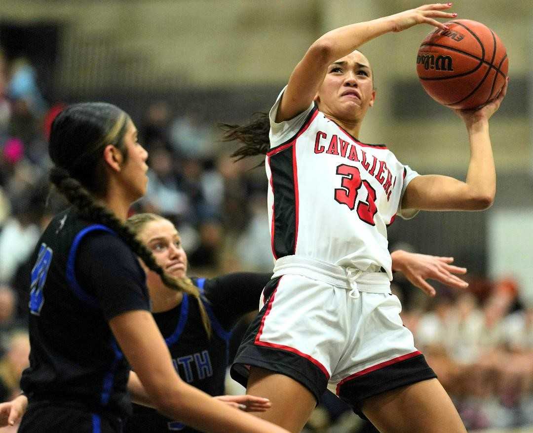 Clackamas junior Jazzy Davidson goes up for two of her 38 points in Friday's win over South Medford. (Photo by Jon Olson)