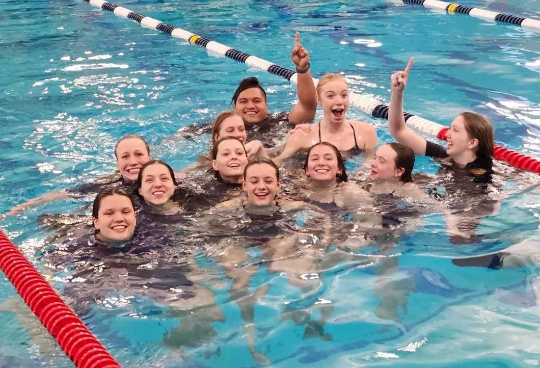 Bend's girls swim team celebrates winning its fourth 5A championship since 2015 in last year's state meet at Tualatin Hills.