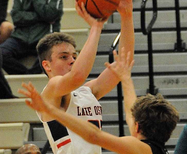 Lake Oswego's Josh Angle made four three-pointers Tuesday, including three in the fourth quarter. (Photo by Andrew Suh)