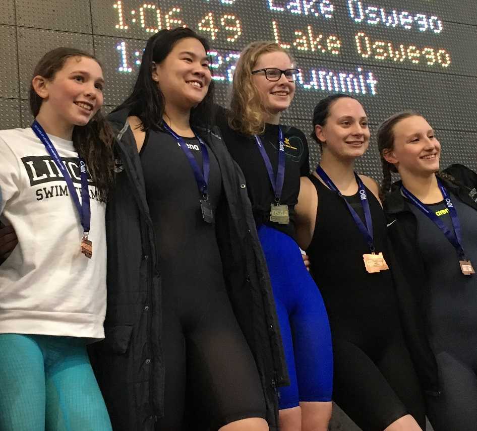 Aloha's Kaitlyn Dobler (center) with the other finalists from the 100 breaststroke.