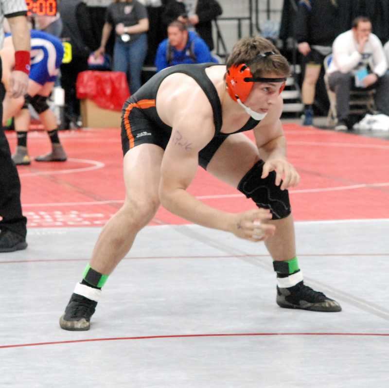 Roseburg junior Rourke Martin has helped put the Indians on top of the 6A wrestling standings in early Friday action
