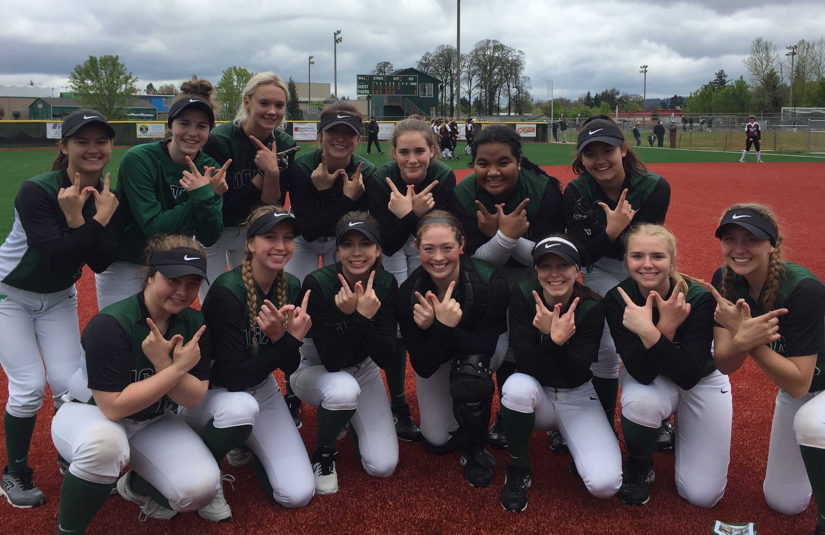 Tigard players pose after beating Tualatin on Saturday.